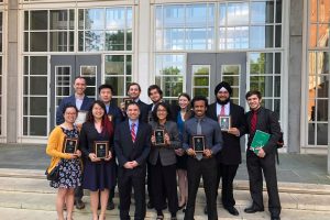 2018 convocation awardees pose with their plaques.