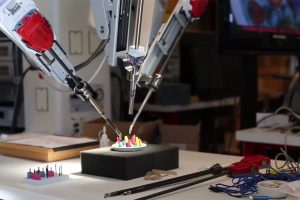 The Da Vinci robot operates on small, colorful phantom objects.