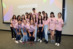 The HopHacks organizing team poses in pink T-shirts.