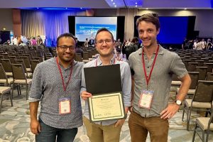 Kanishka Misra, Aaron Mueller, and Jon Gauthier pose with their Outstanding Paper Award at ACL'23.