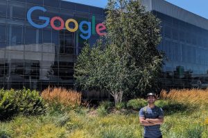 Bhavik Agarwal poses in front of a Google building.