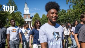 Brian Robinson, a Johns Hopkins University freshman, walks with other incoming students on the campus in Baltimore.