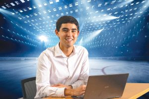 An image of Tad Berkery with his laptop is superimposed over a hockey rink.