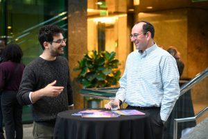 Nicolas Loizou and Mark Dredze speak at a Data Science & AI Institute event.