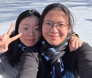 Michelle Wang and Alisa Yang post together.