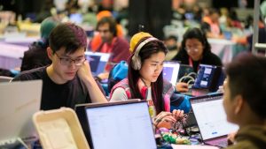 Members of the ChainSplash team working during the ETHGlobal Hackathon.