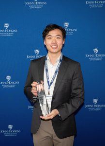Oren Wei poses with a trophy.