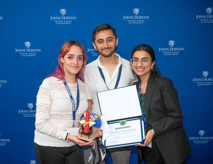 The NΔvi team poses with a device and certificate.