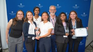 The TriageNow and RescueReady teams with Larry Aronhime at HopStart 2025 holding their awards.