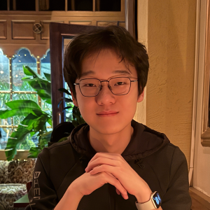 Headshot of Hua "Harry" Jiang in a restaurant.